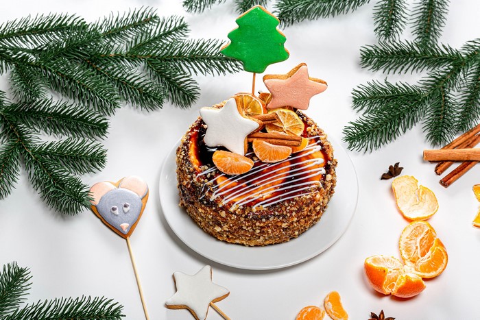 Christmas cake with cookies and tangerines
