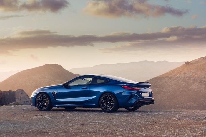 Blue BMW M8 Competition Coupe on Rocky Terrain