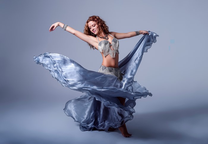 Alba Morales belly dancing with a flowing skirt