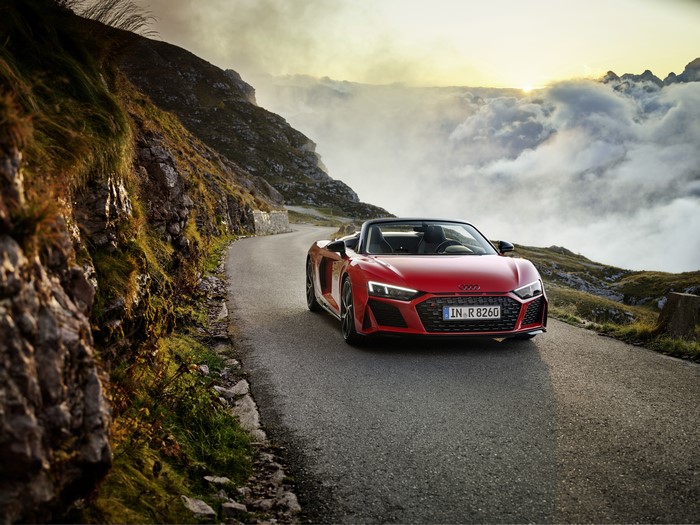 Red Audi R8 Spyder V10 on a mountain road