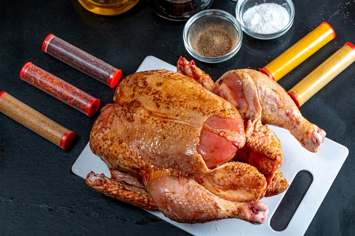 4K Chicken with Spices on Cutting Board
