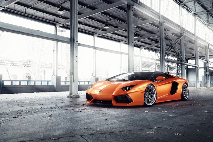 Orange Lamborghini Aventador VAG in industrial building
