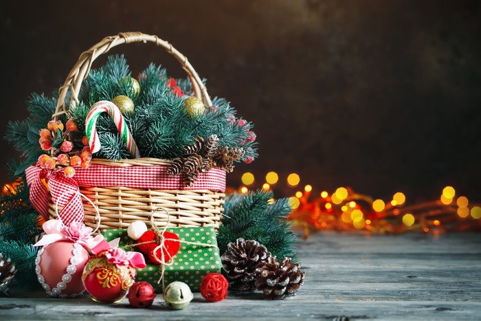 Christmas Wicker Basket with Ornaments and Pine Cones