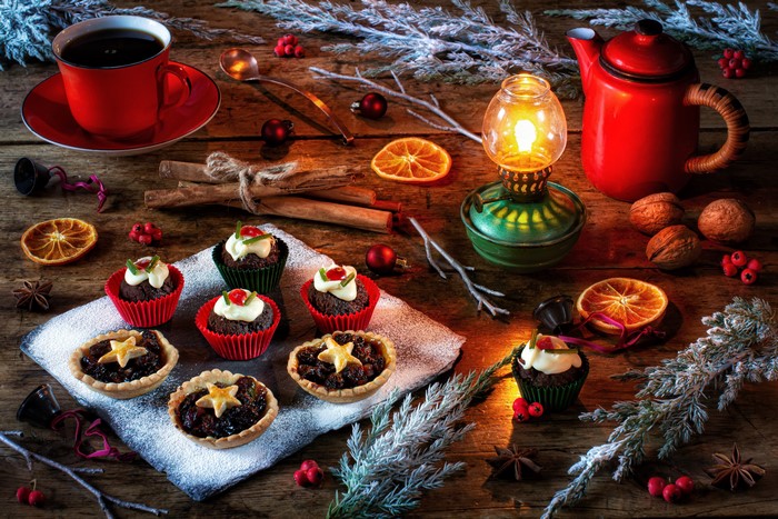 Christmas still life with coffee, cakes, and decorations