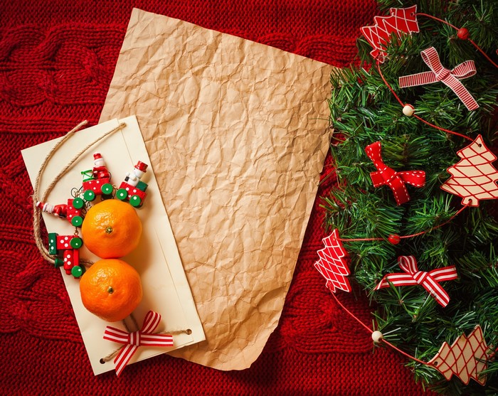 Christmas decorations with tangerines and paper