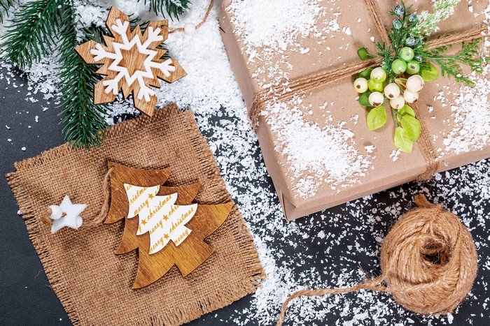 Christmas gift with wooden ornaments and snow