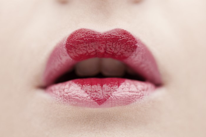 Close-up of red lips with heart shape