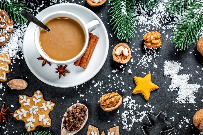Christmas coffee with cookies, nuts, and spices