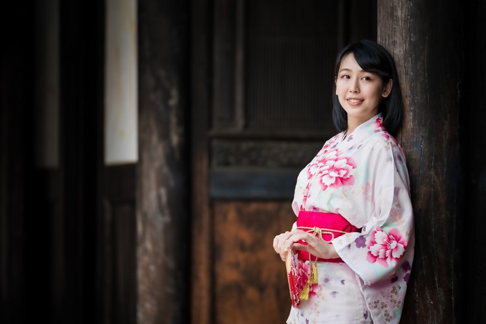 Asian woman in kimono with fan