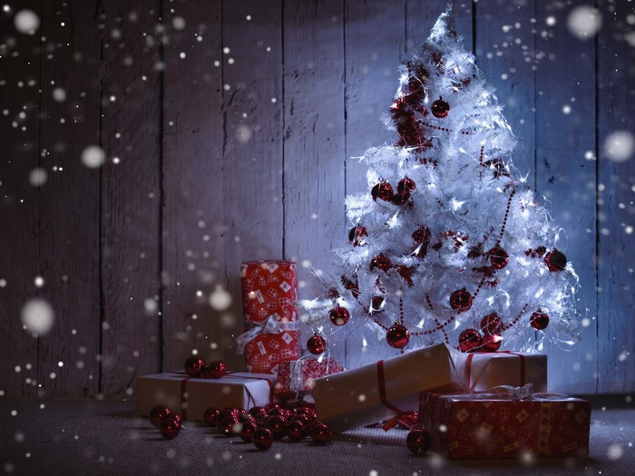 White Christmas tree with red ornaments and gifts