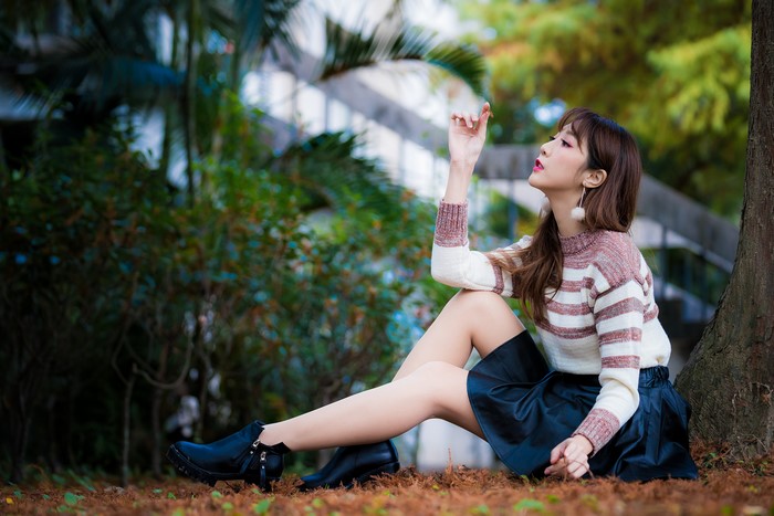 4K Serene Asian Woman Sitting Outdoors