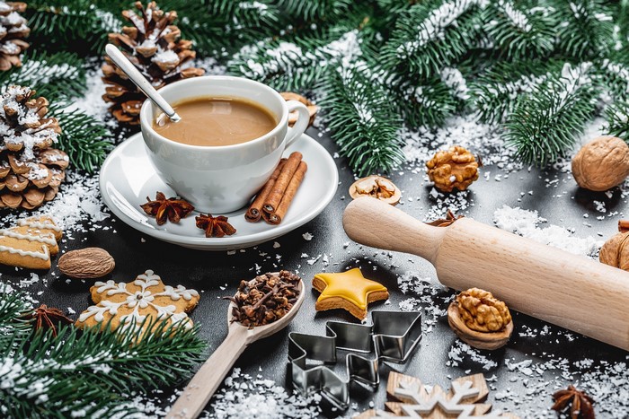 Christmas cookies, coffee, and spices with pine branches