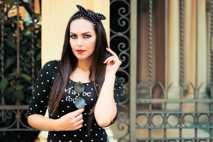 Woman with polka dot dress and sunglasses