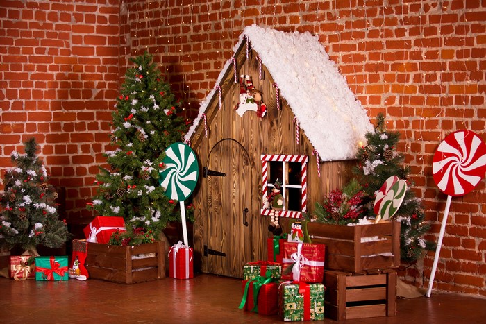 Christmas scene with gingerbread house and gifts