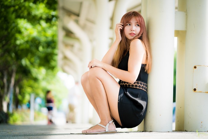 4K Asian Woman Sitting with Bokeh Effect
