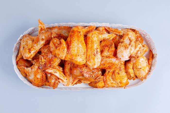 Marinated chicken wings on a platter