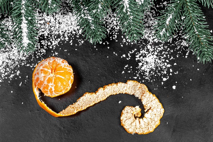 Mandarine with Christmas Tree Branches and Snow