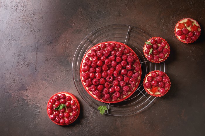 Raspberry tarts on a cooling rack