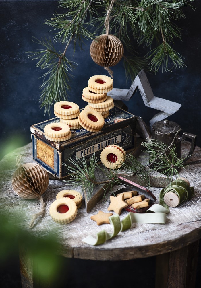 Christmas cookies on a rustic table with pine branches