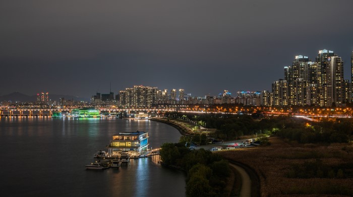 Seoul cityscape at night with Han River and buildings