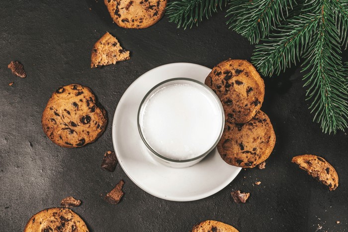 Chocolate chip cookies and milk with pine tree