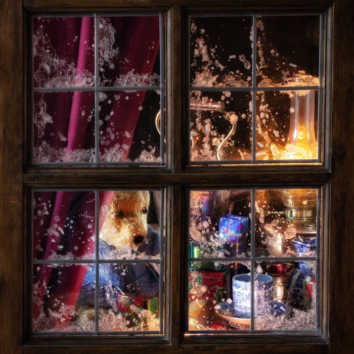 Teddy bear and gifts seen through a frosted window