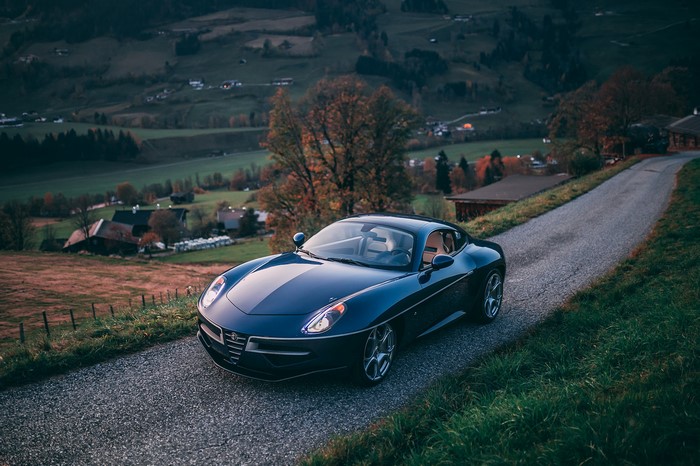 Blue Alfa Romeo Disco Volante Touring on a country road
