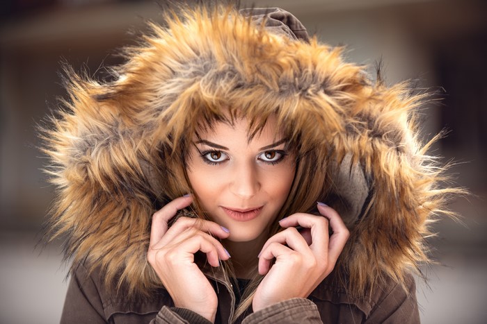 Woman in a fur-lined hooded jacket