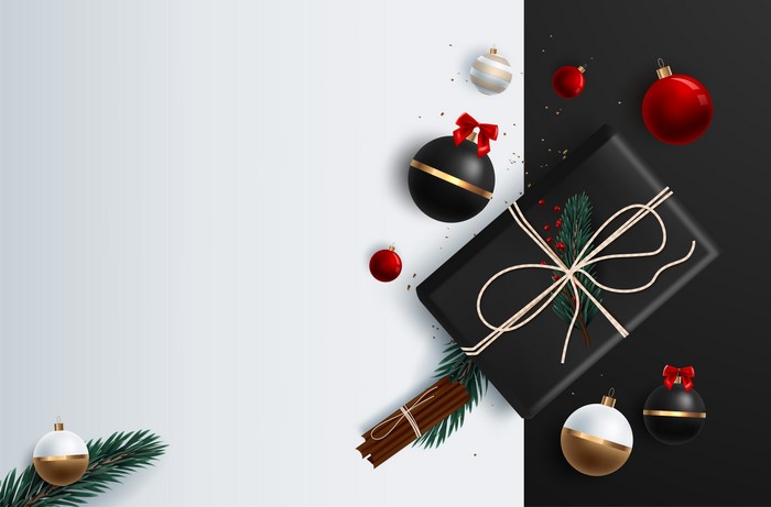 Christmas gift with ornaments and cinnamon sticks