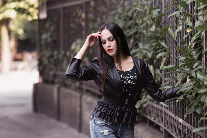 Valentina in a leather jacket and jeans