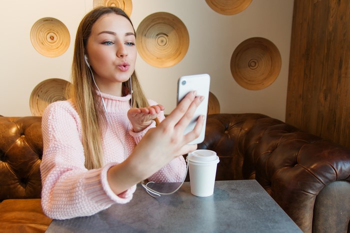 Woman taking a selfie with a smartphone