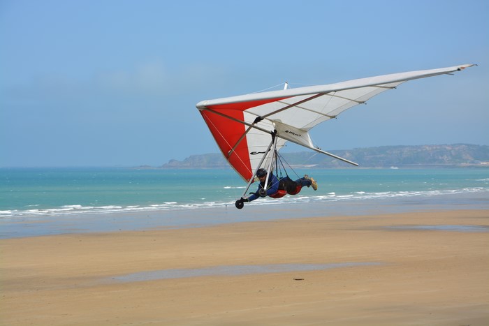 Hang-gliding over a beach