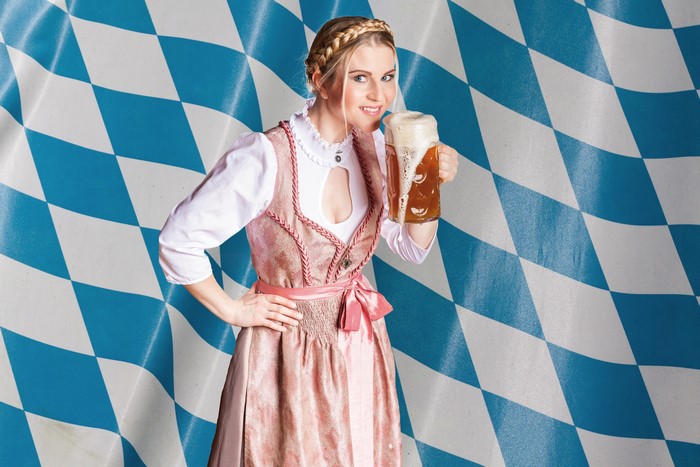 Woman in Dirndl holding a beer mug