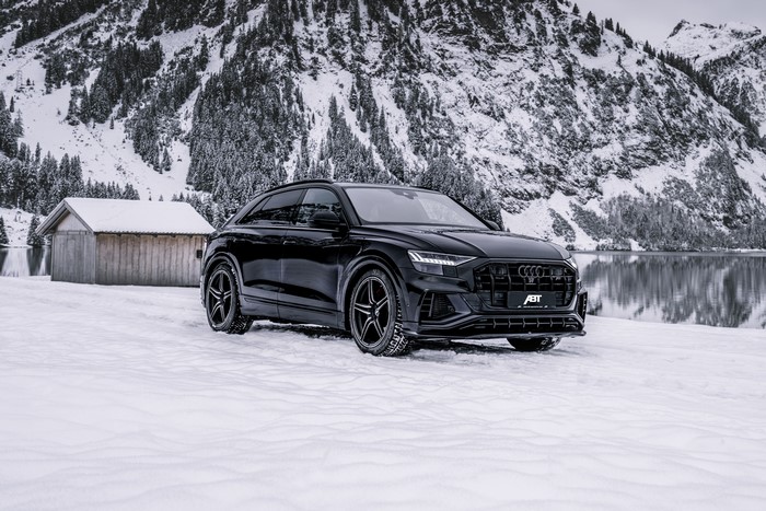 Black ABT SQ8 TDI in winter landscape