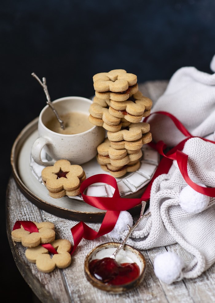 Still life with coffee, cookies, jam, and ribbon