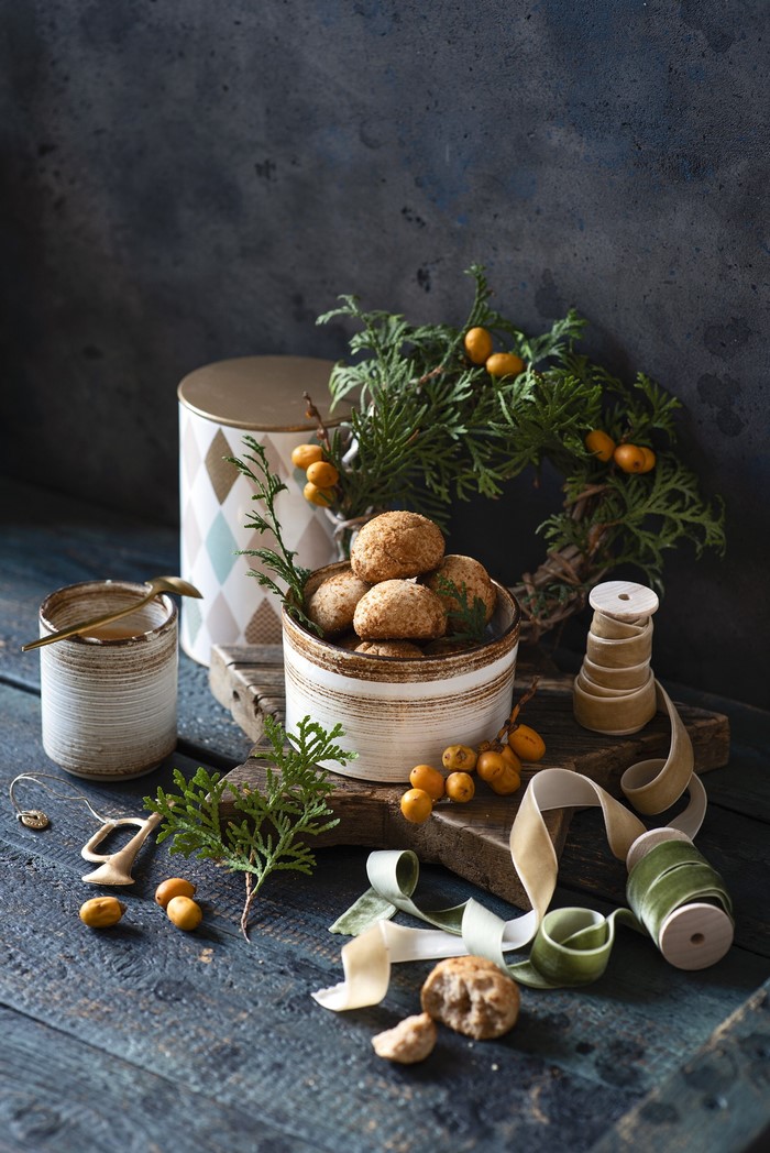 Still life with cookies, berries, and greenery