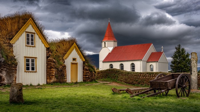 Grass-roofed houses and church in Iceland