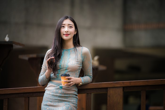 Asian woman holding a cup of tea