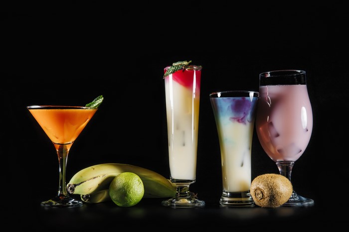 Cocktails with Bananas, Kiwi, and Lime on Black Background