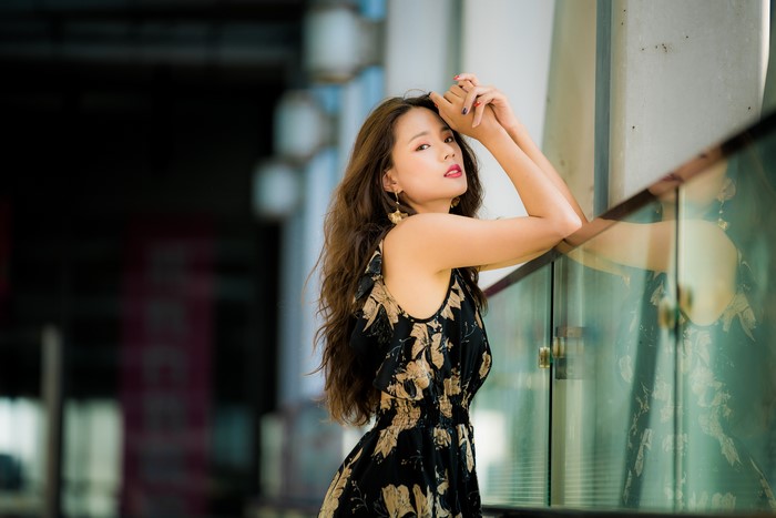 Asian woman with brown hair in a floral dress
