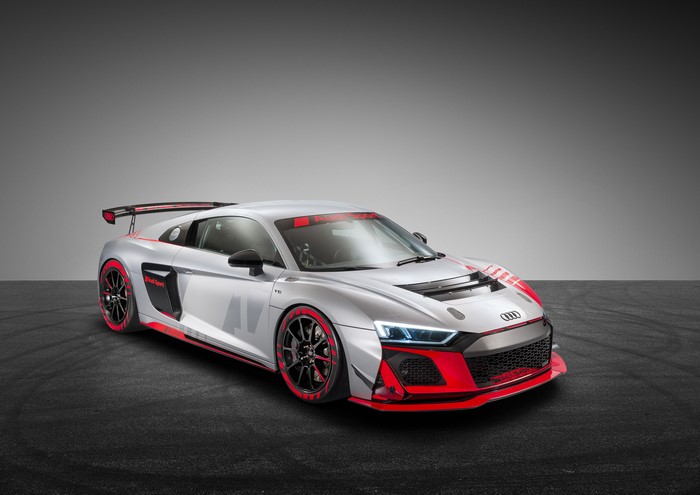 Silver Audi R8 LMS GT4 race car with red accents