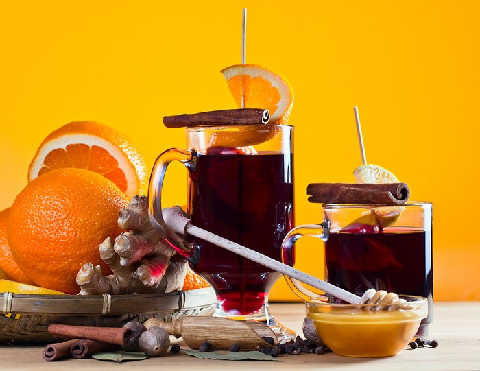 Mulled wine with oranges, cinnamon, ginger, and honey