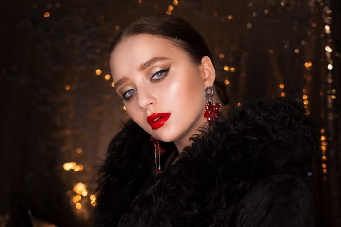 Brunette girl with red lips and makeup