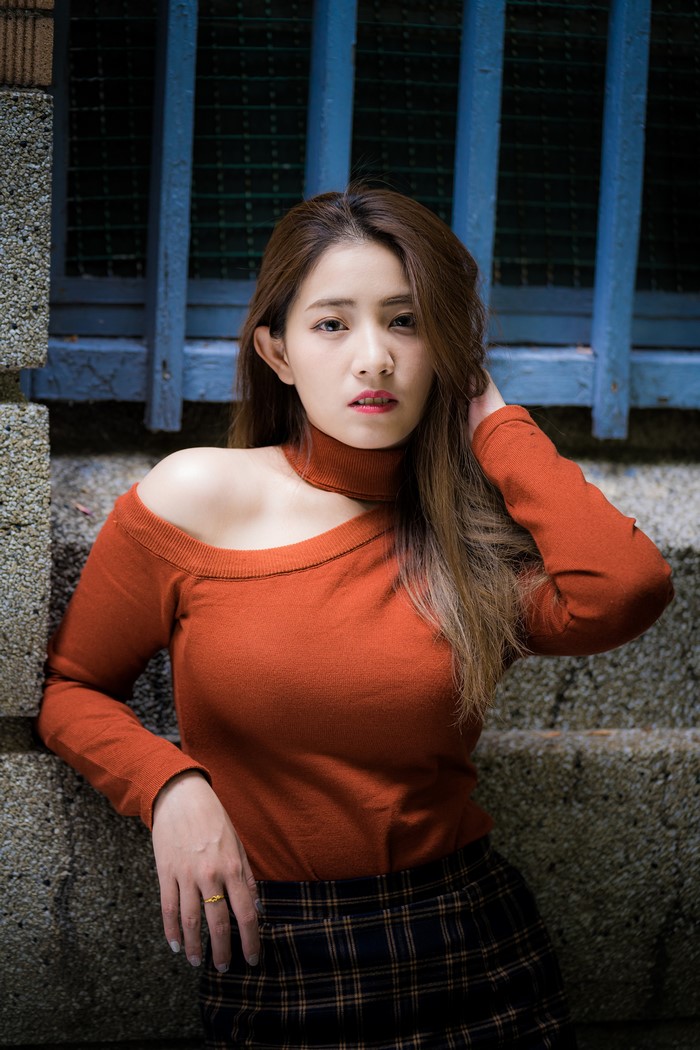 Asian Woman in Rust Orange Sweater Pose