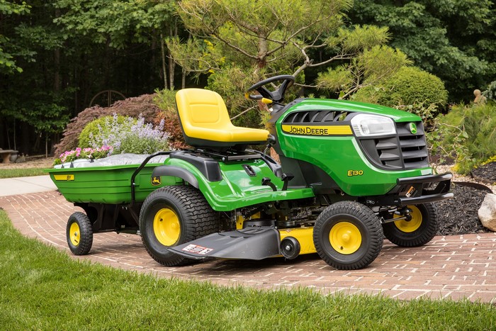 John Deere E130 riding lawn mower with trailer