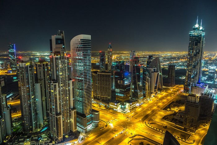 Dubai skyscrapers and roads at night