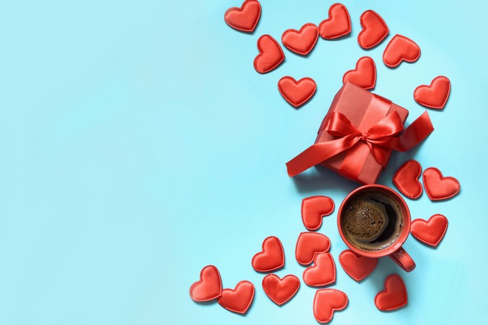 Red gift box and coffee cup with hearts