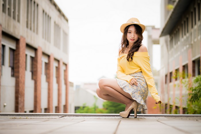 4K Asian Woman Sitting in Yellow Blouse