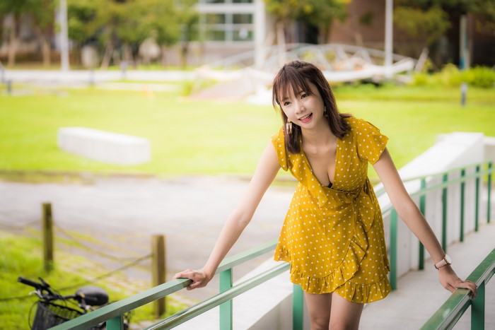 4K Asian Woman in Yellow Polka Dot Dress