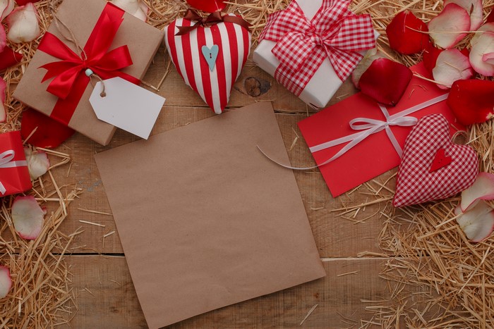 Valentine's Day gifts and petals on straw